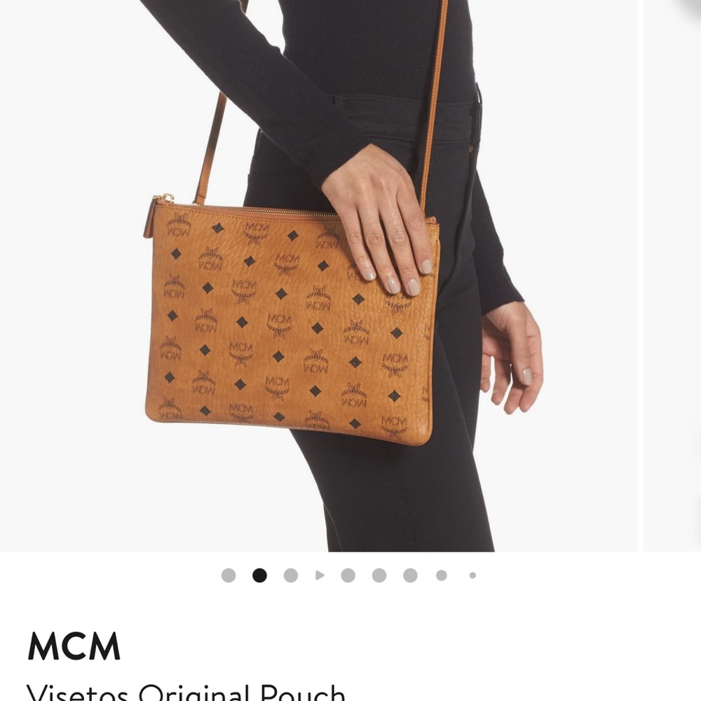 MCM crossbody has some wear in the bottom corners, not visible while wearing.